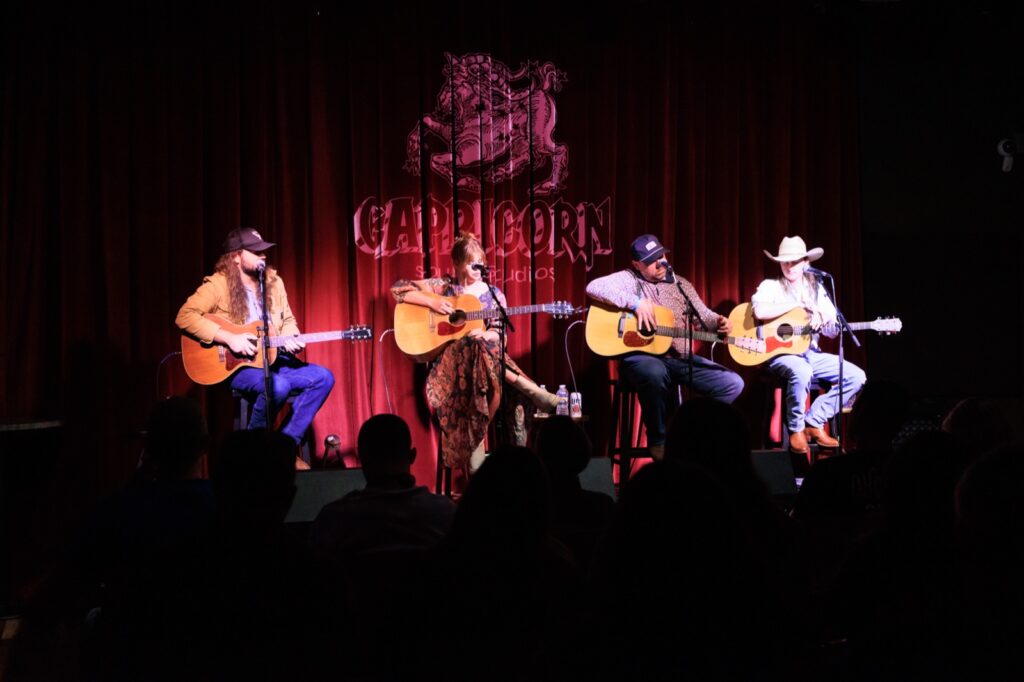 Musicians on stage at Capricorn