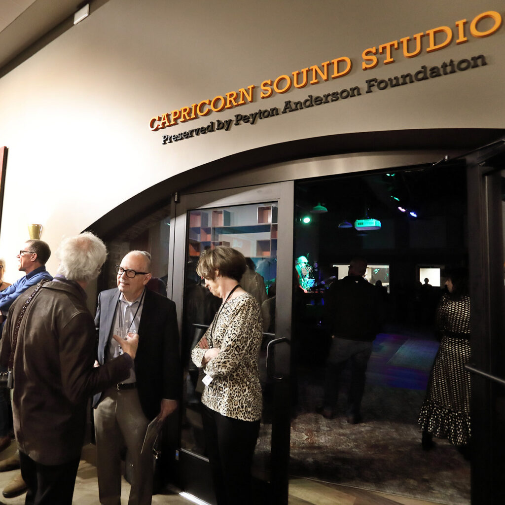 Visitors chatting at an event at Capricorn