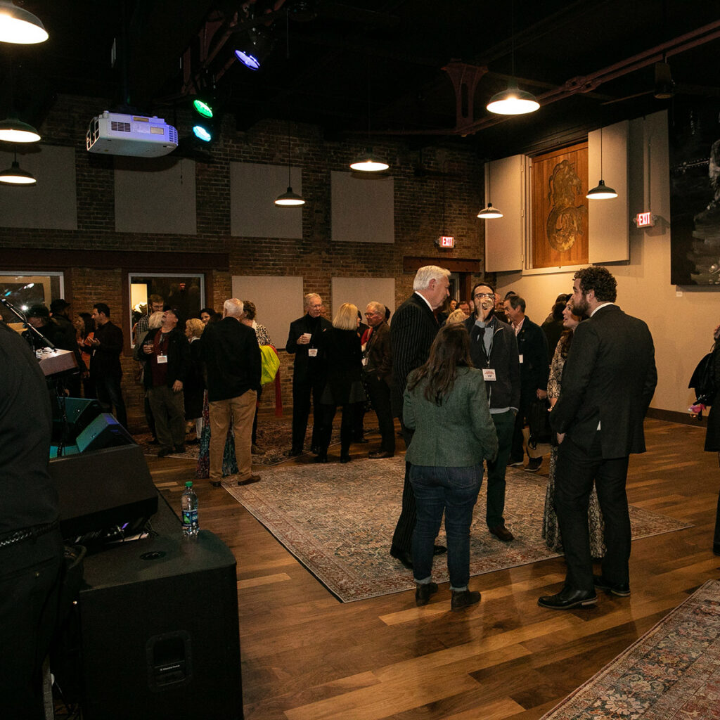 Visitors talking with each other at an event at Capricorn