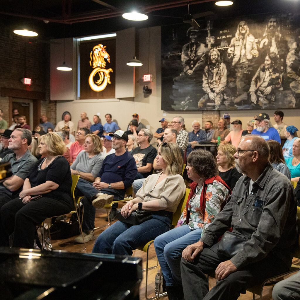 Photo of crowd at a panel event in Studio B