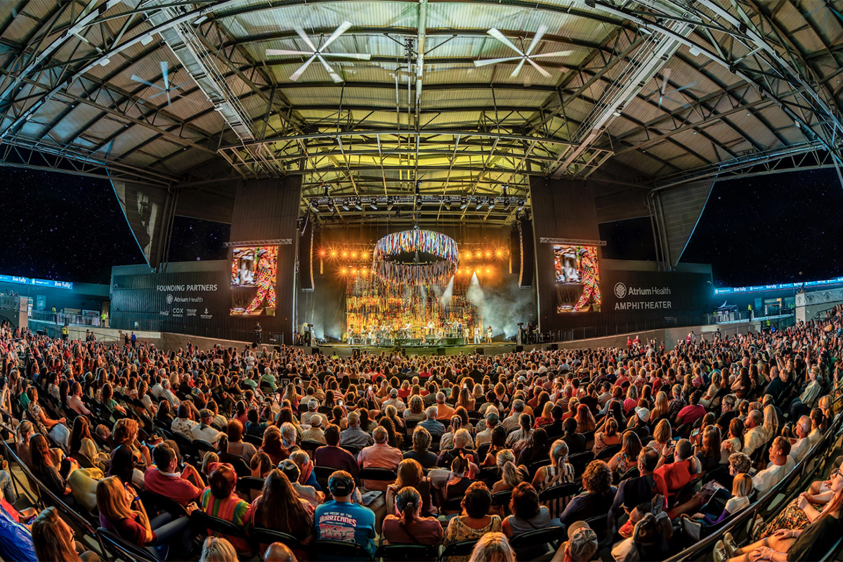 Crowd at an outdoor concert at the Atrium Health Amphitheater