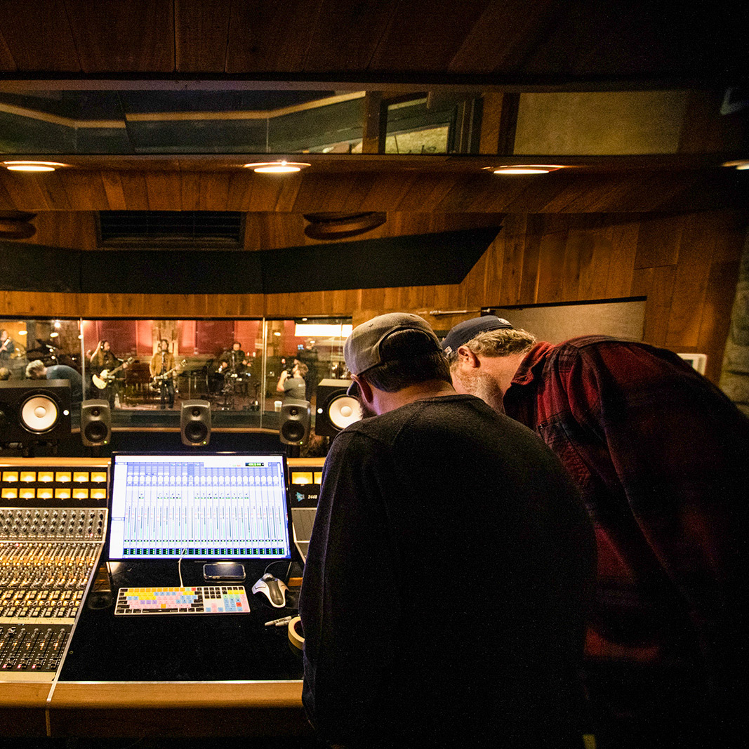 Producers inside of a music studio