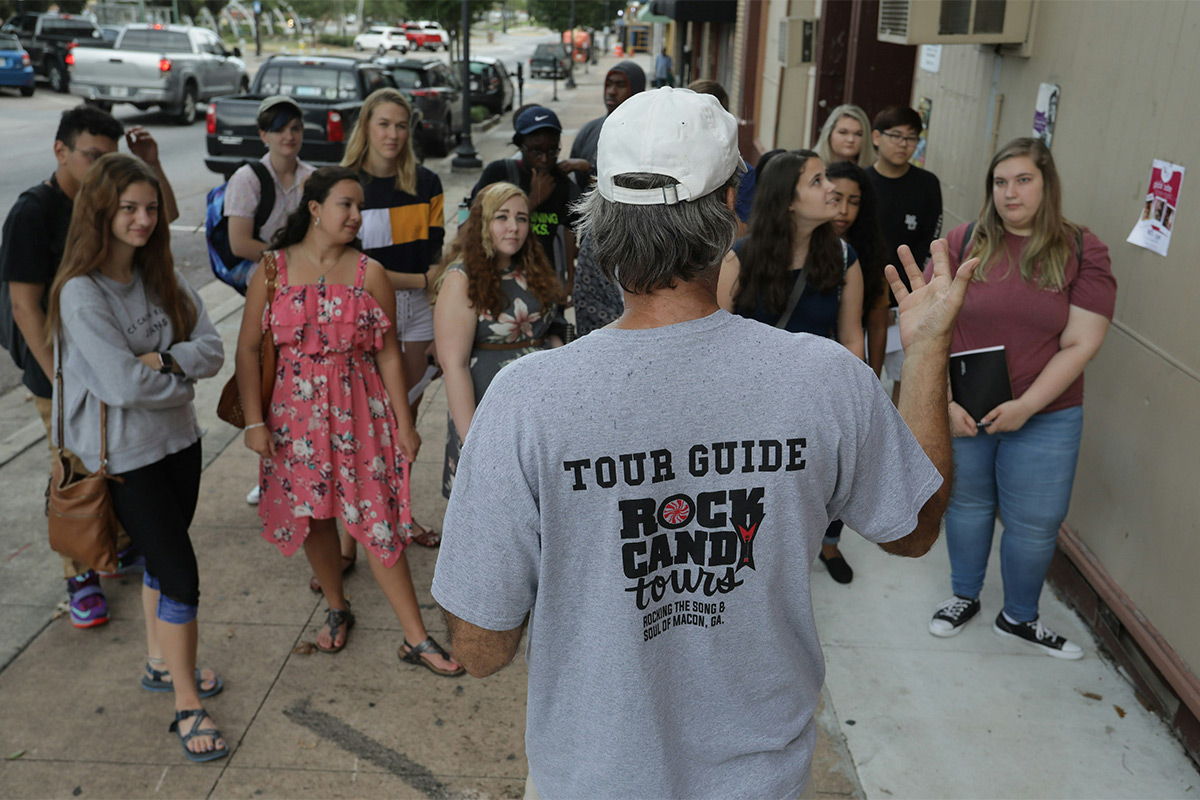 Guide giving a tour to a group of people